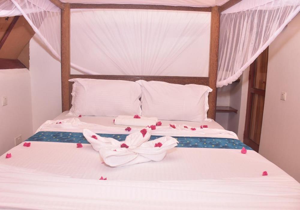 Utulivu Bungalow Нунгви Экстерьер фото