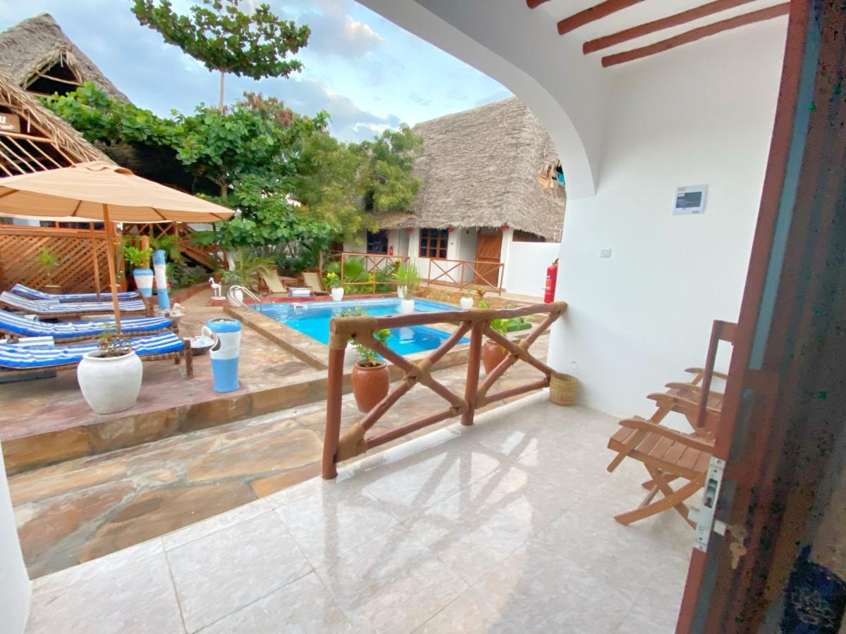 Utulivu Bungalow Нунгви Экстерьер фото